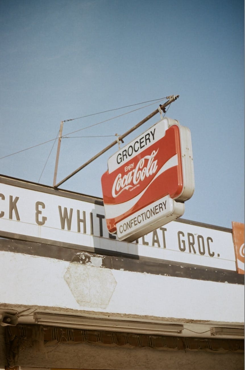 coca cola sign outside grocery store