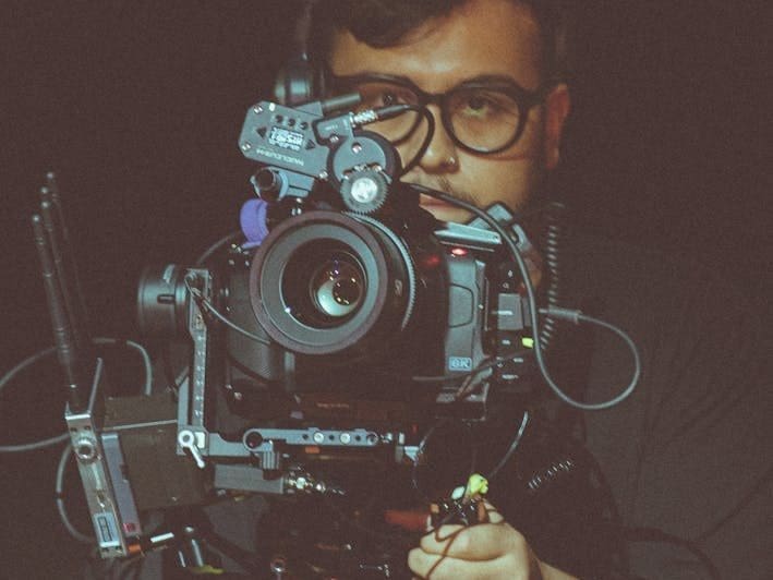 man holding a professional camera