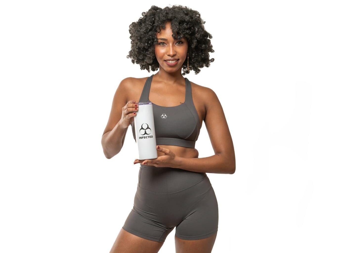 woman holding sports bottle in activewear
