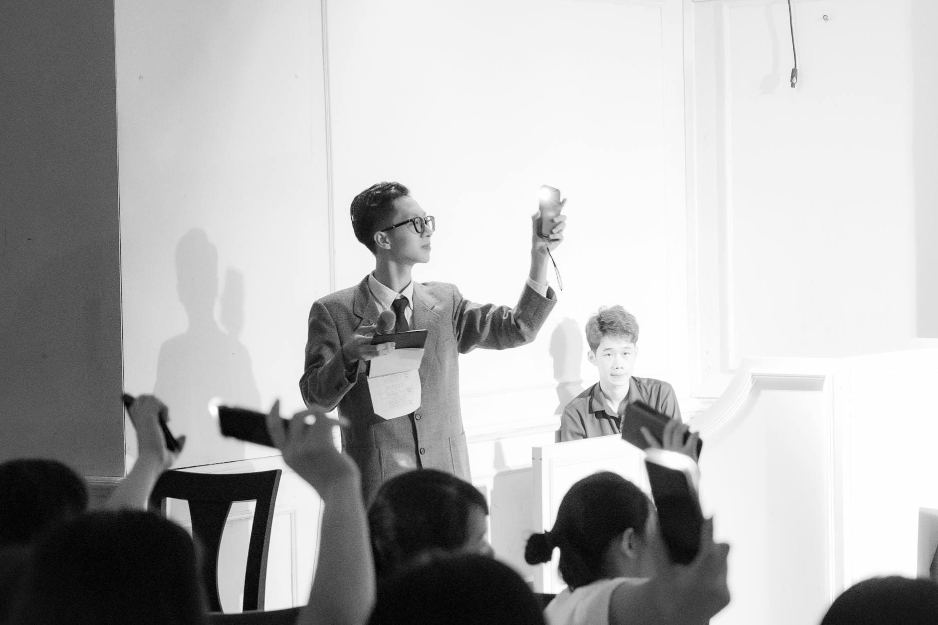 black and white auction scene with bidders