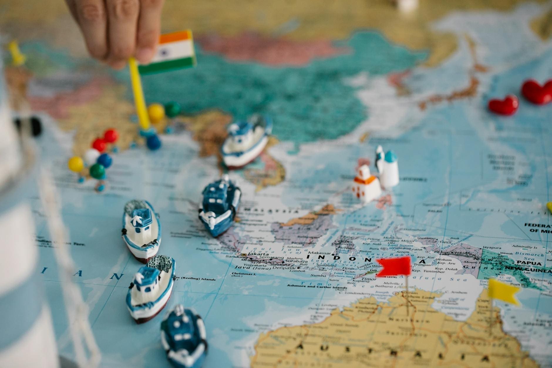 tiny ships and flags on world map
