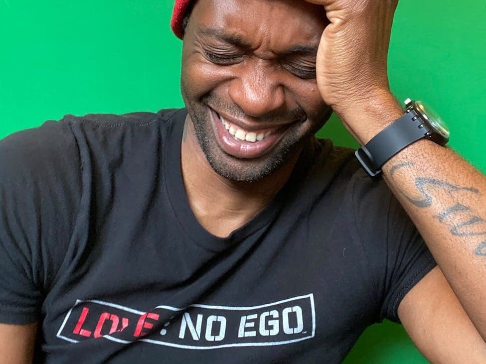 close up photo of man wearing red beanie