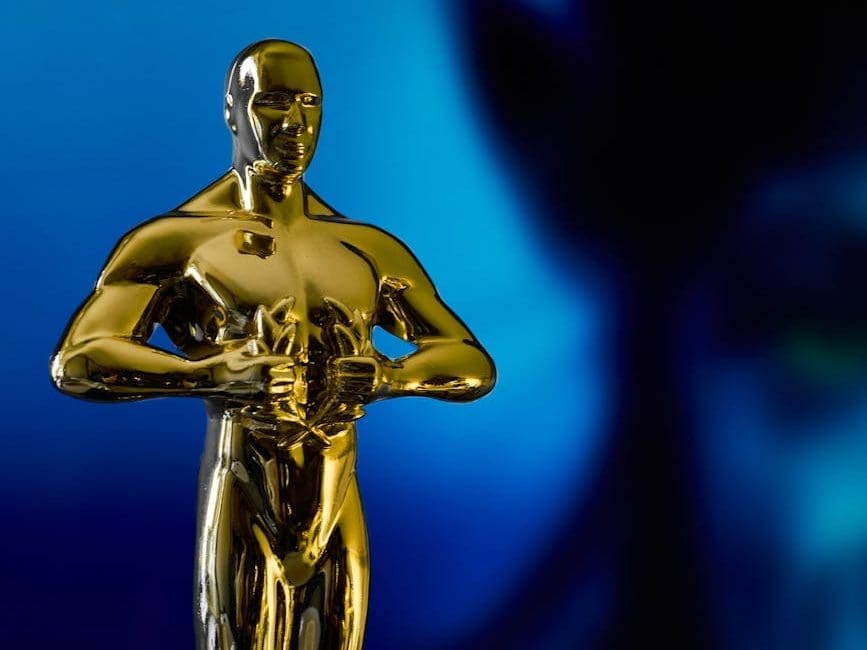academy award in front of blue alien character