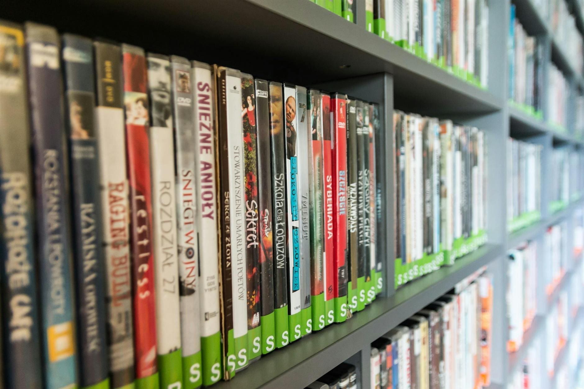 assorted dvd case lot on shelves