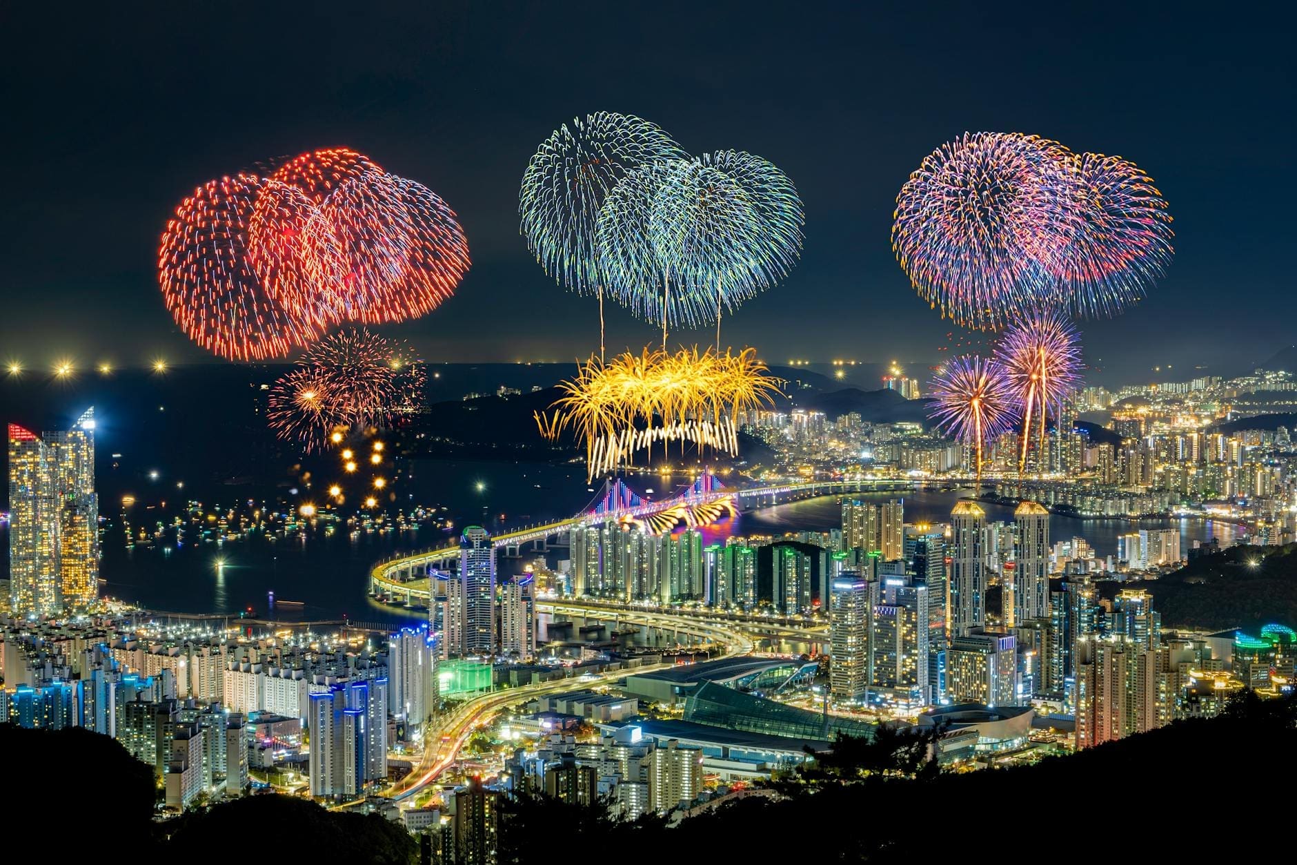 spectacular fireworks over busan skyline at night