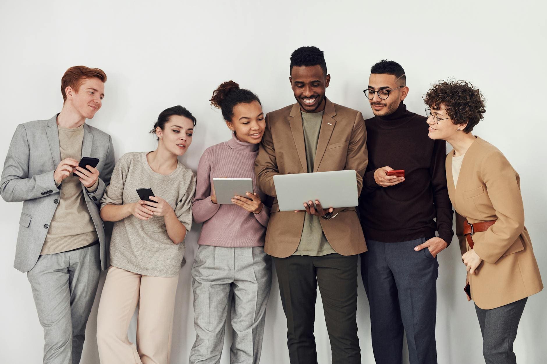 group of people looking at laptop screen