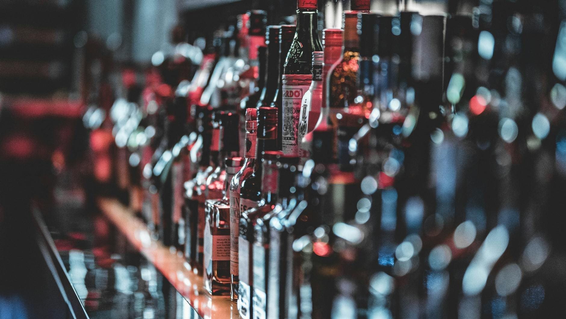 selective focus photo of alcohol bottles