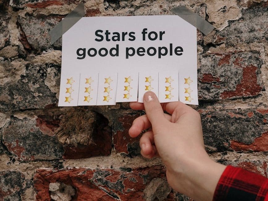 hand holding sheet with writing stars for good people