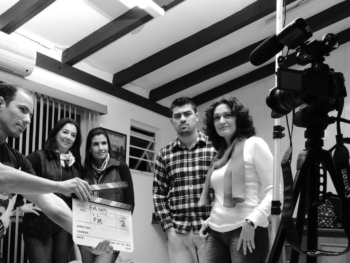 grayscale photo of group of people in recording session