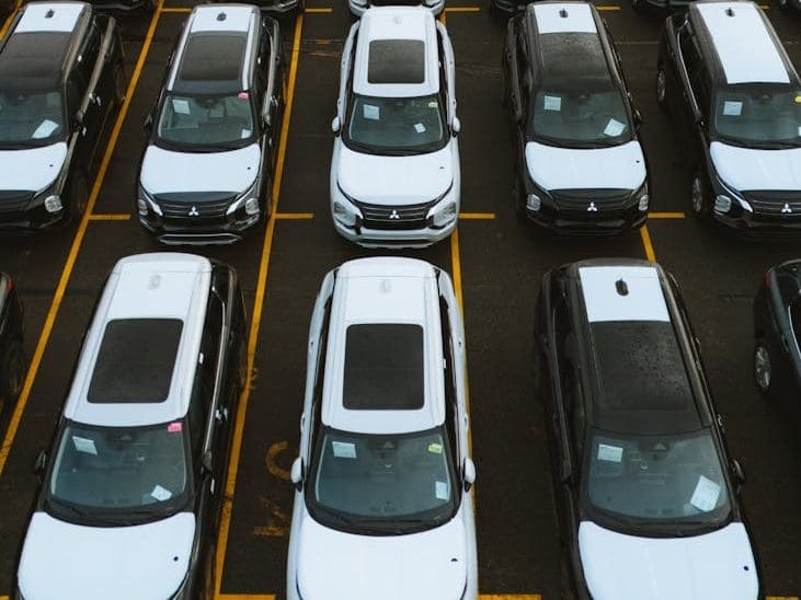 aerial view of car lot with parked vehicles