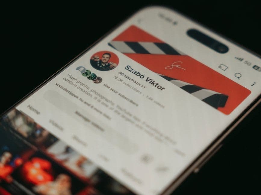 close up of smartphone displaying youtube channel