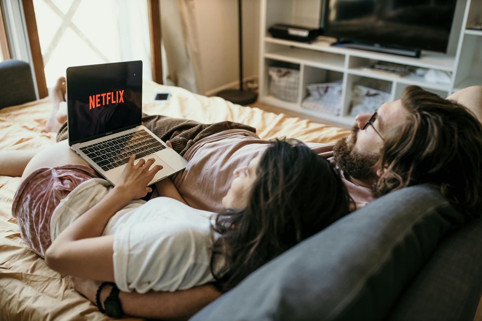 a couple lying in bed