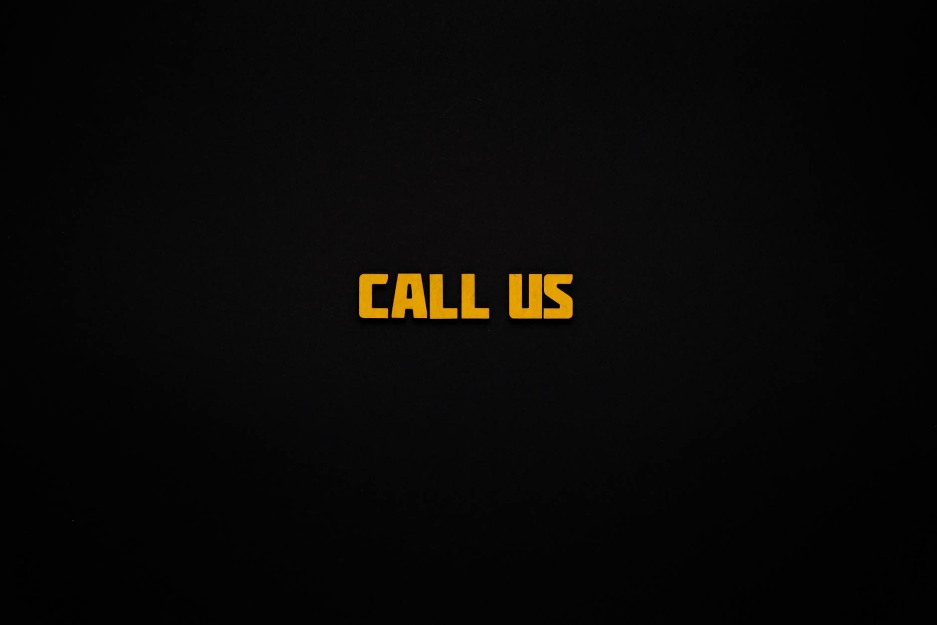 the words call us on a black background