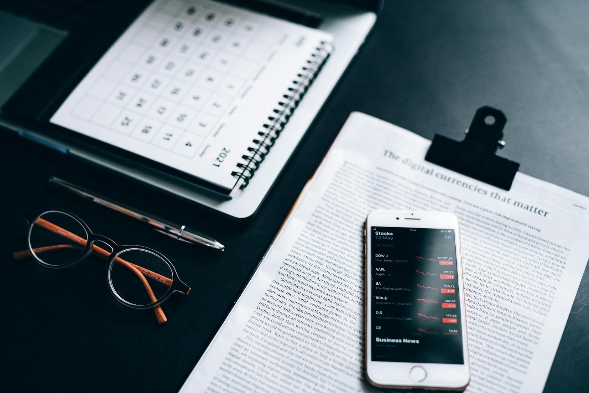smartphone on a clipboard with printout