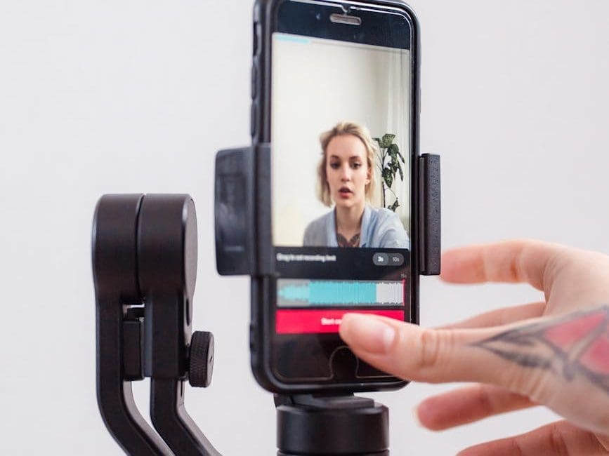 woman streaming with a smart phone for her video blog