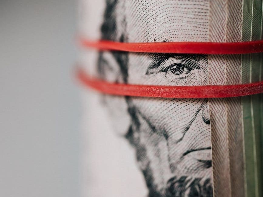 roll of american dollar banknotes tightened with band